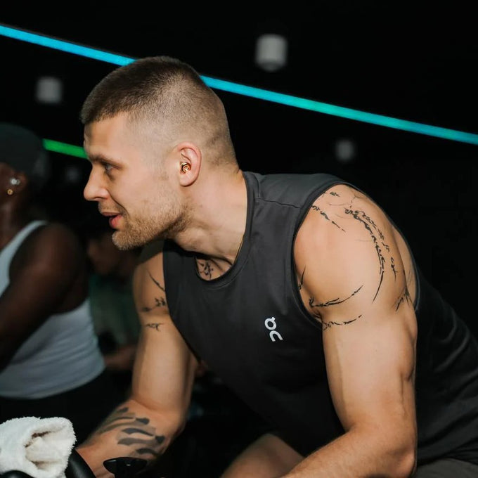 Man wearing Switch 2 Gold in a gym setting