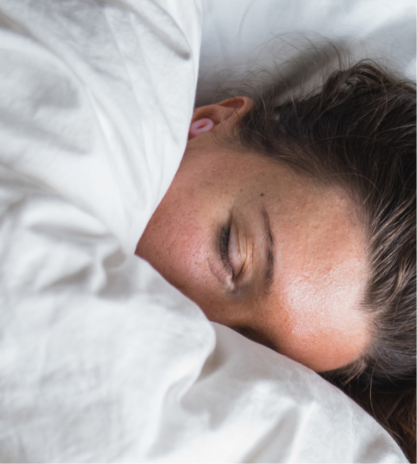 Woman sleeping with earplugs