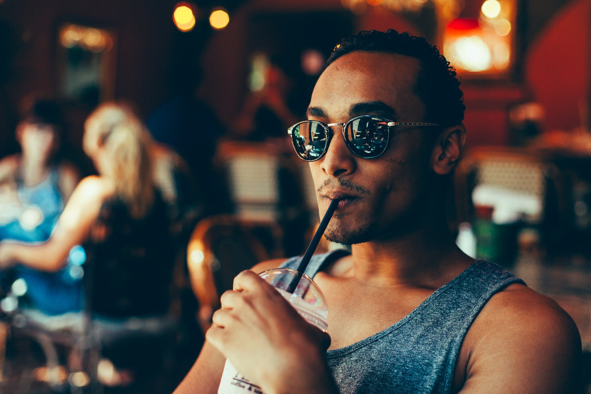 Man Drinking From Straw